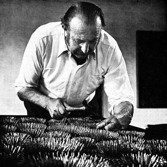 Eduard LADAN working on one of his nail assemblages in 1970 (photo by David Baker, Cape Town)