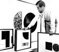 Ernst DE JONG with some of his paintings, 1964