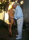 Peter Davis in 2010 holding "Standing woman with plait" in mahogany 